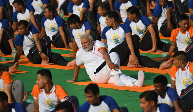 yoga powerful unifying force in strife-torn world: modi